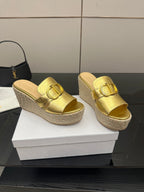 Gold leather wedge mules with square-toe buckle straps on jute espadrille platforms.