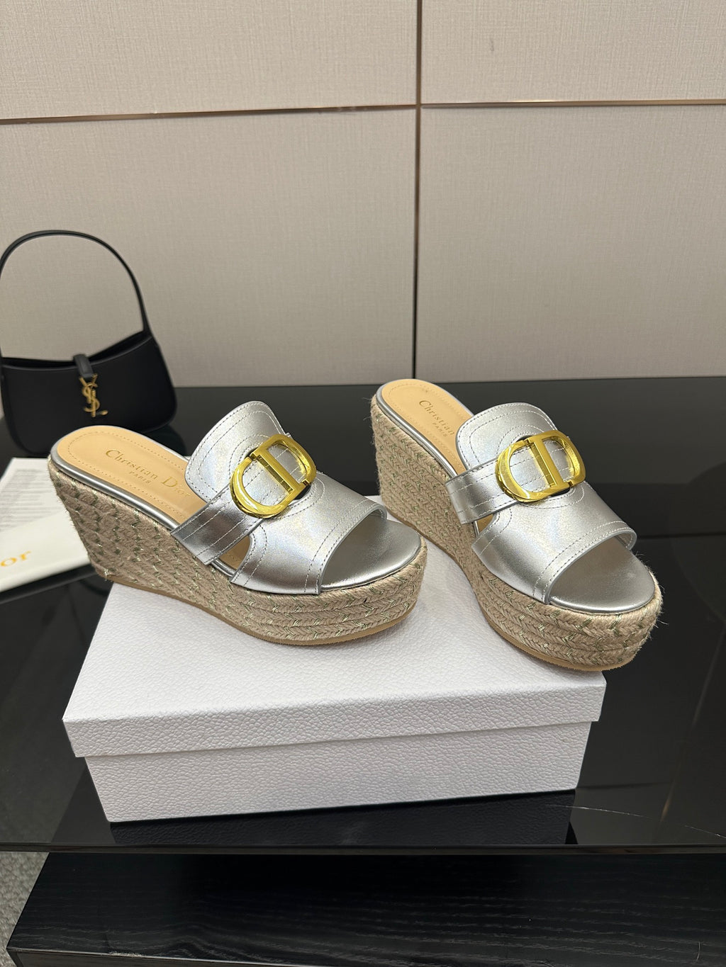 Pair silver slip-on wedge mules with gold buckle and textured jute sole