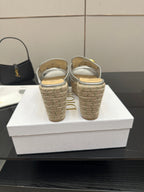 Back view of silver wedge mule sandals with woven jute heel and footbed