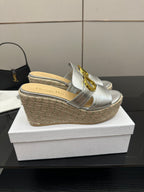 Silver leather platform mule with gold buckle strap and woven jute wedge heel
