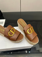 Brown leather slide wedge sandals with gold D buckle and espadrille platform