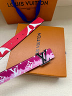 Louis Vuitton belt with pink and red monogram strap and metal LV buckle.
