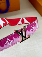 Louis Vuitton belt close-up with pink monogram strap and LV metal buckle.