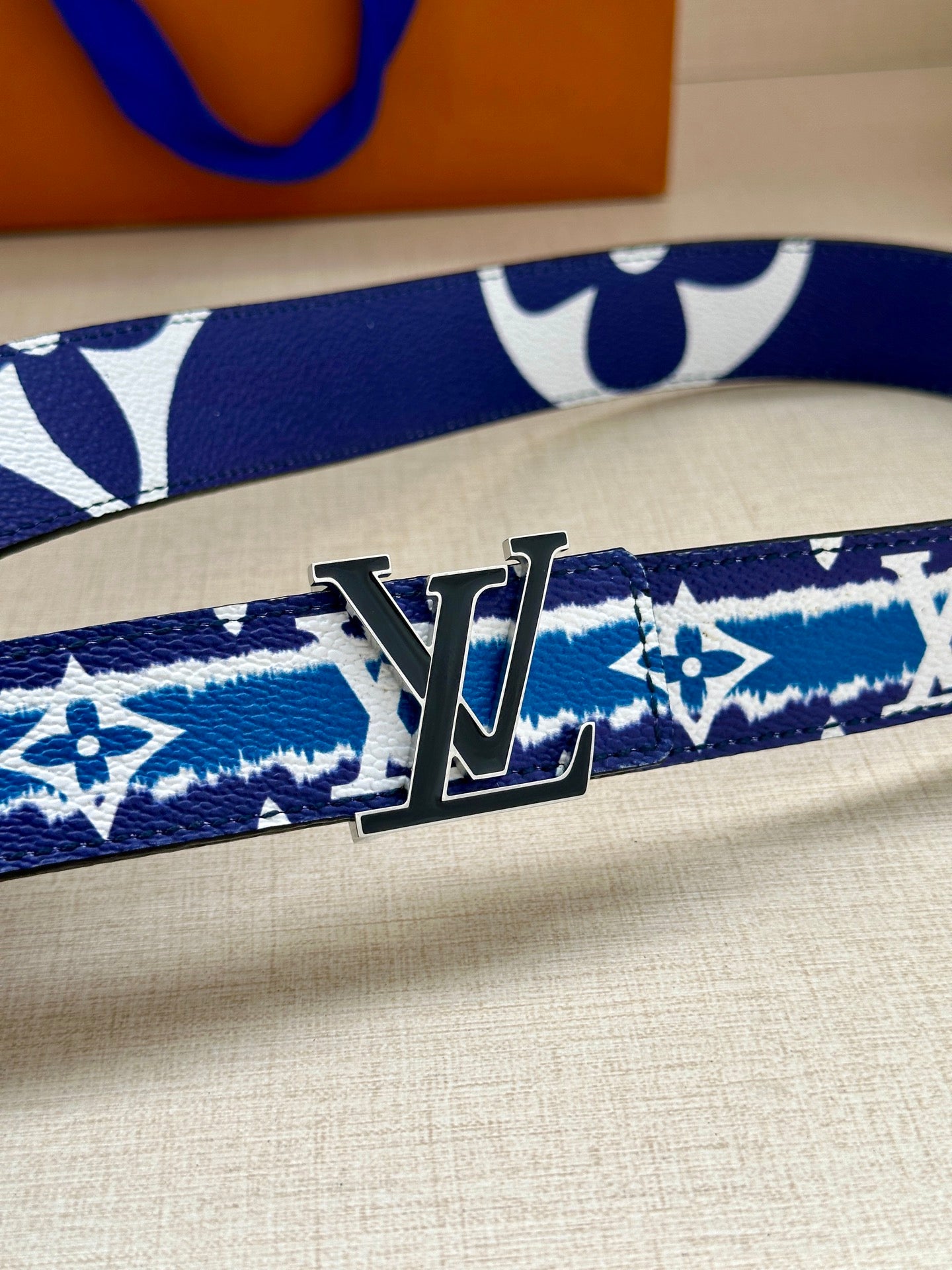 Blue and white monogram belt with oversized gold buckle
