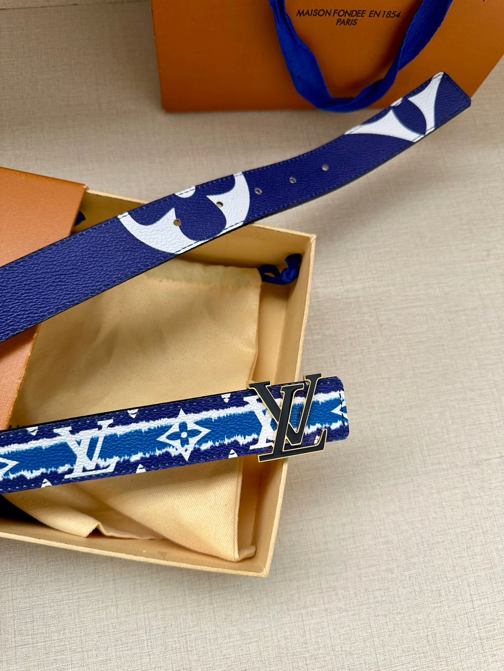 Blue and white monogram belt with gold buckle, unboxed