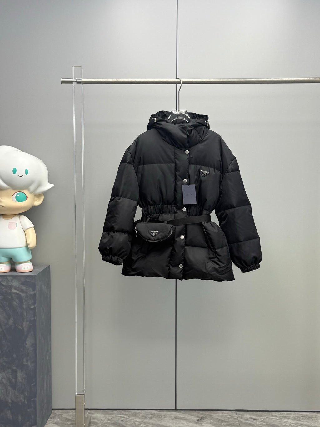 Prada black hooded puffer coat with belt, button front closure and side pockets
