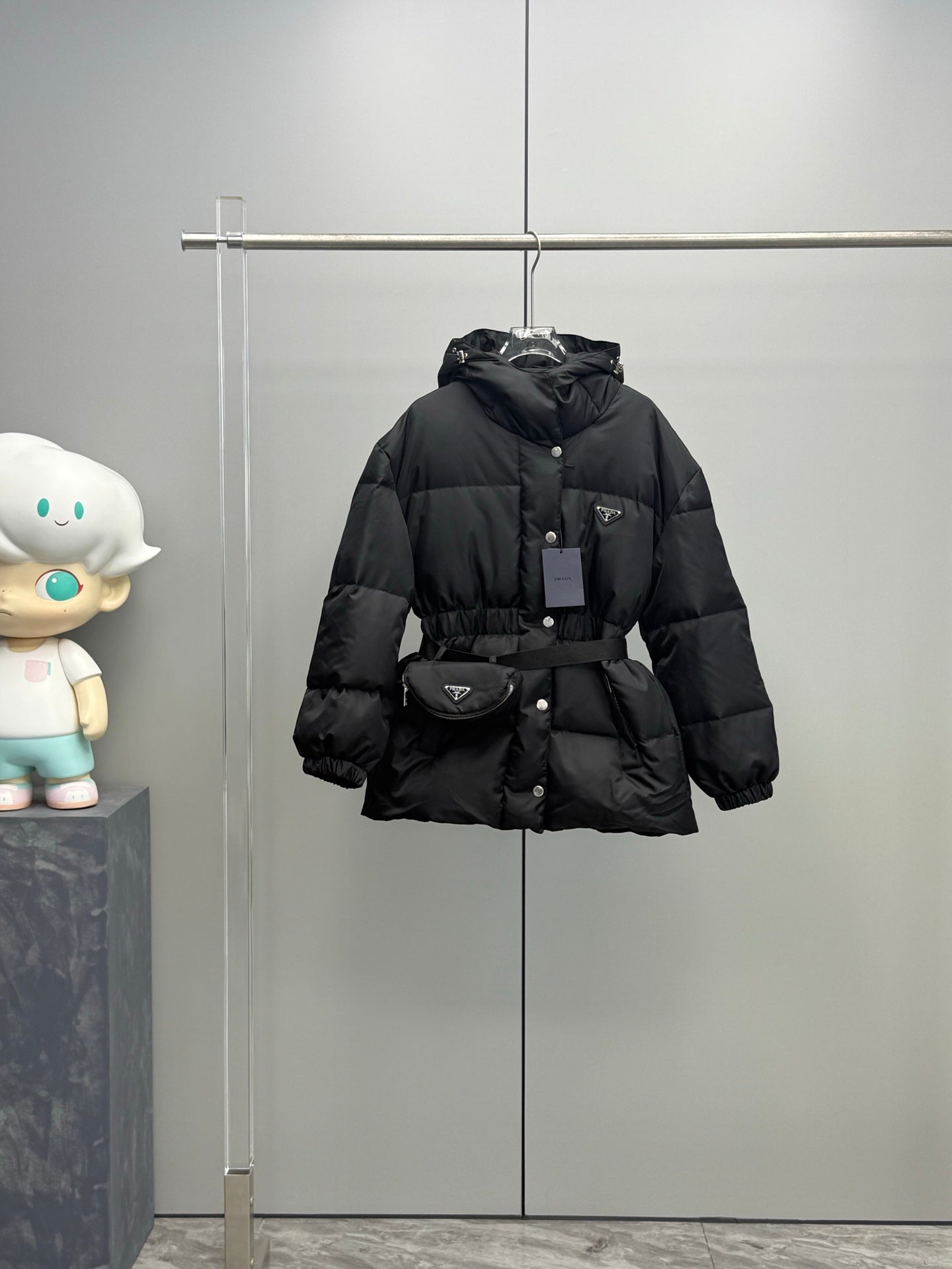 Prada black hooded puffer coat with belt, button front closure and side pockets