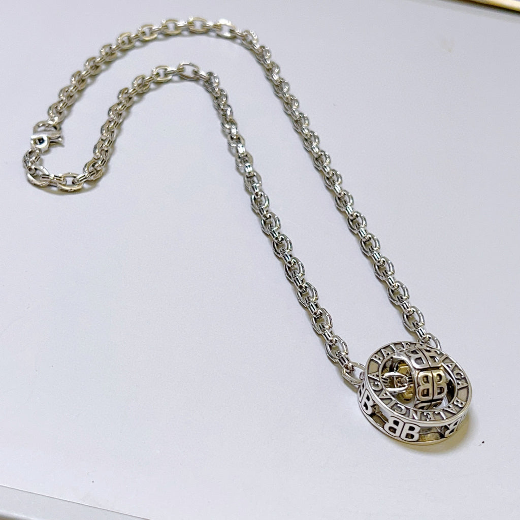 Silver-tone chain necklace with round monogram pendant