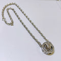 Silver-tone chain necklace with round monogram pendant