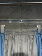 Balenciaga pants with elastic waistband, light gray body and blue side panels