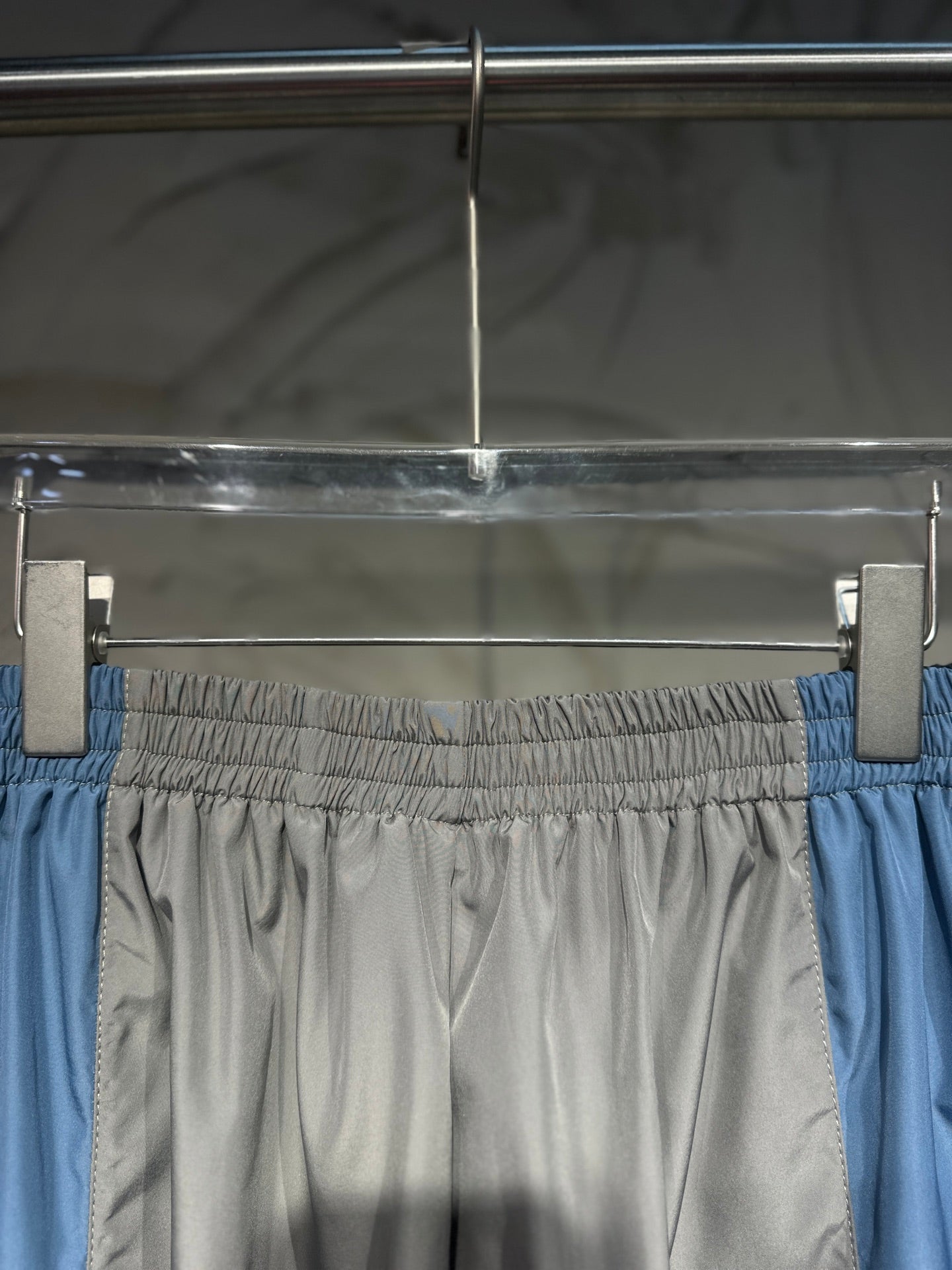 Balenciaga pants with elastic waistband, light gray body and blue side panels