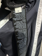 Balenciaga pants care label inside seam with printed size and washing text