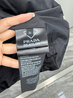 Prada RE-NYLON size and care label marked 36 on black puffer coat