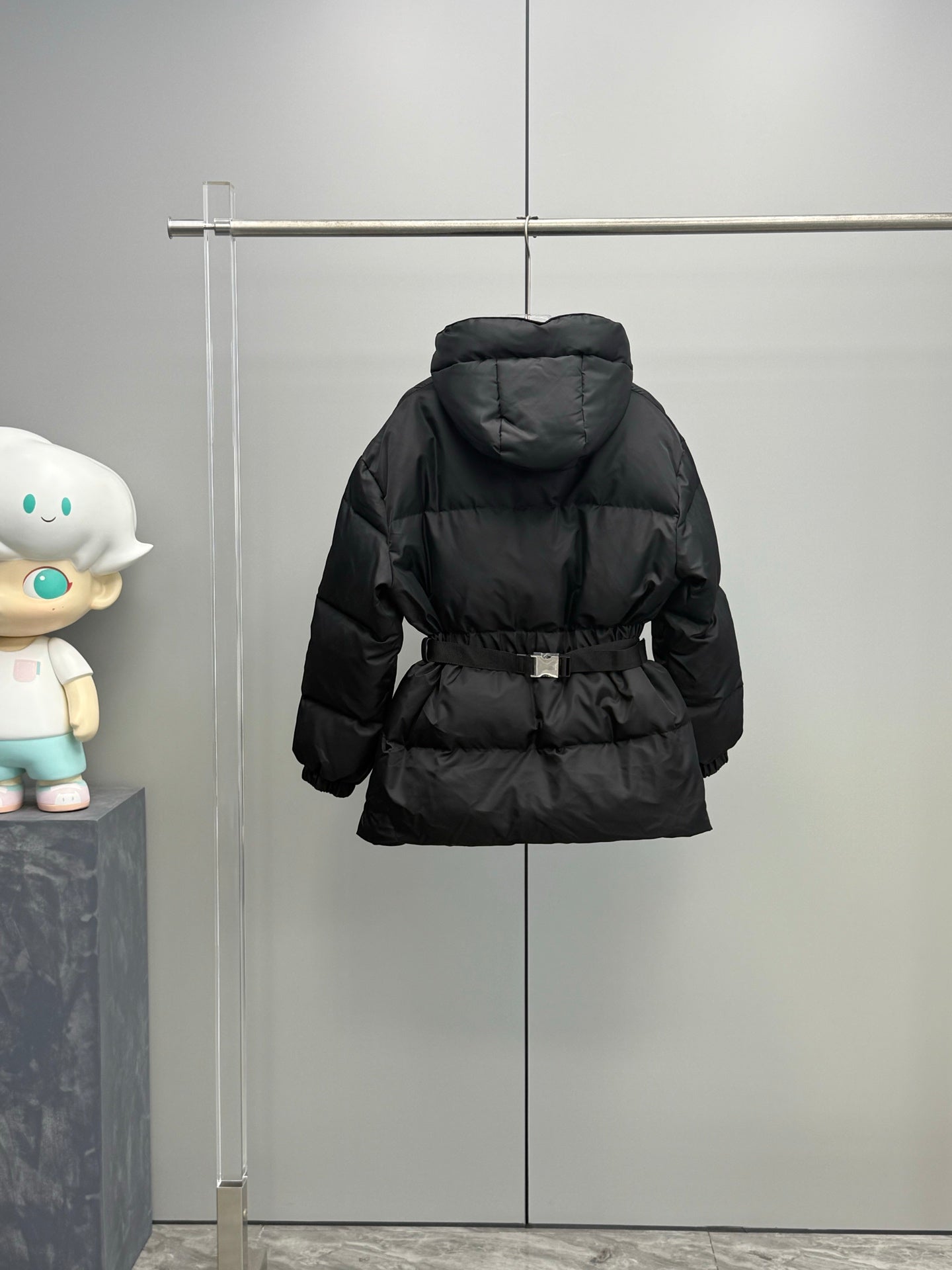 Prada black hooded puffer coat with belt and quilted panels, back view