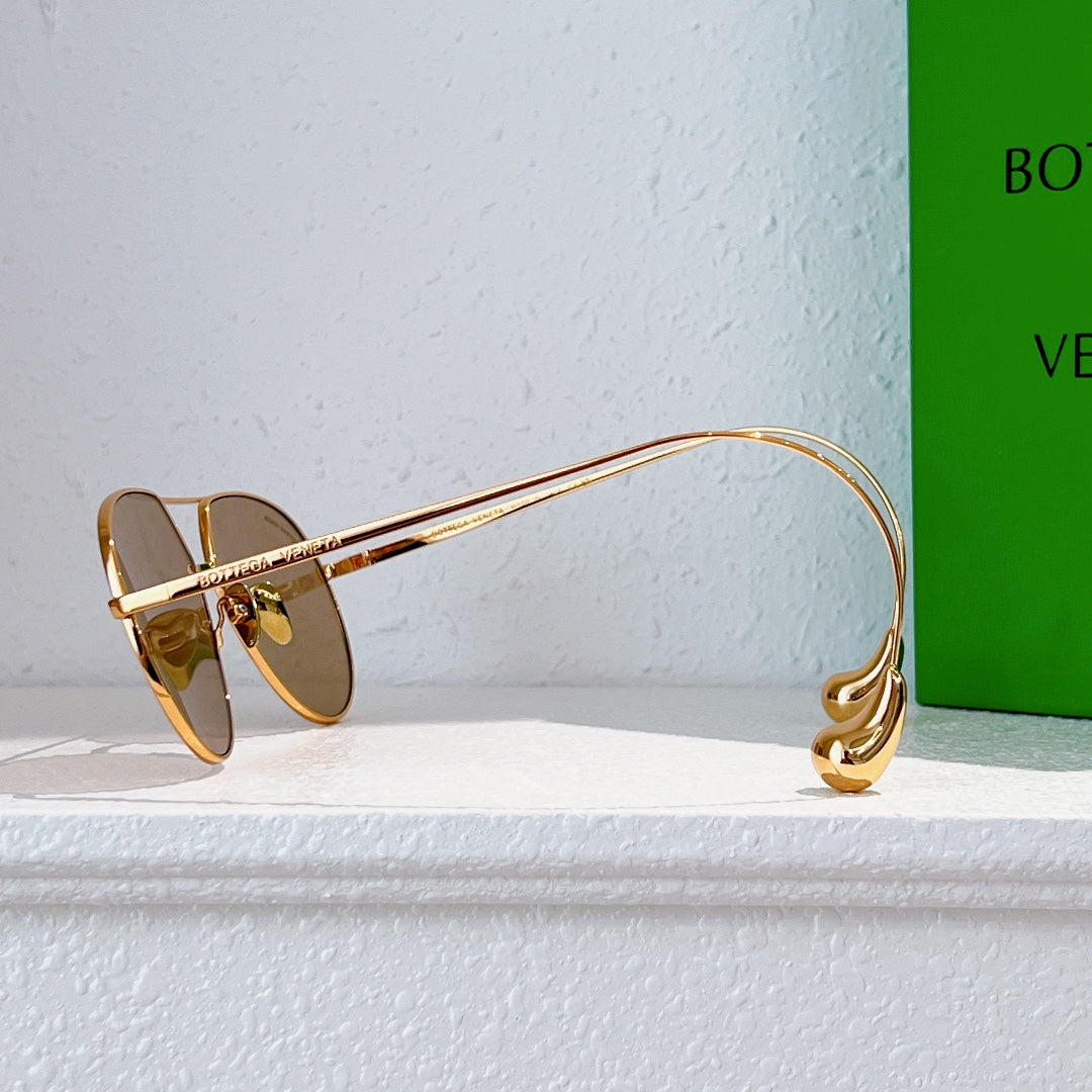 Gold-tone sunglasses with brown tinted lenses and slim side arm