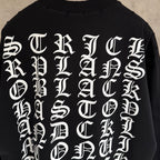 Black long-sleeve sweatshirt close-up of white back letter graphic