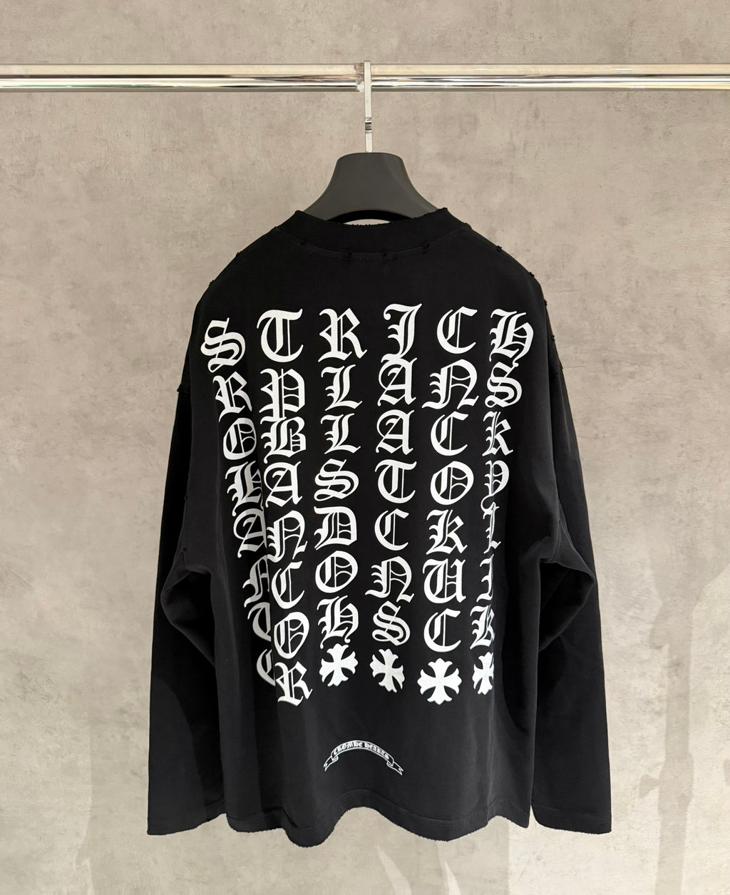 Black long-sleeve crewneck sweatshirt with large back typographic graphic