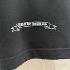 Black long-sleeve sweatshirt close-up of white ribbon logo text