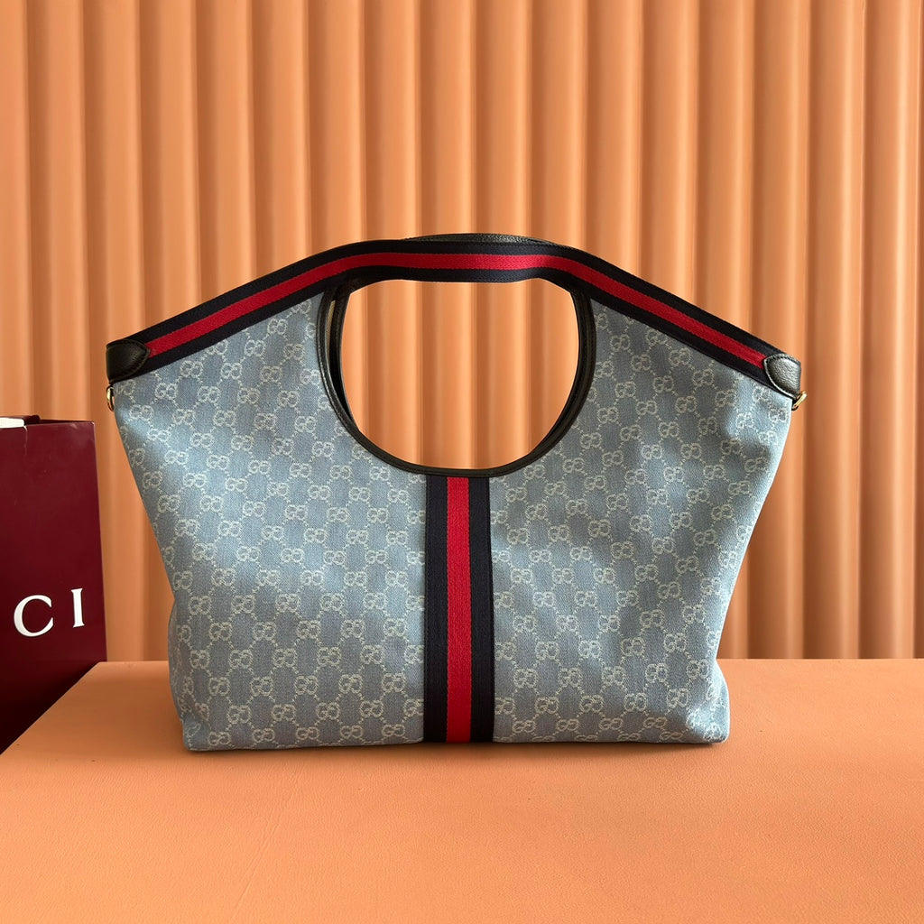 Gucci tote bag with blue monogram print and red/black center stripe