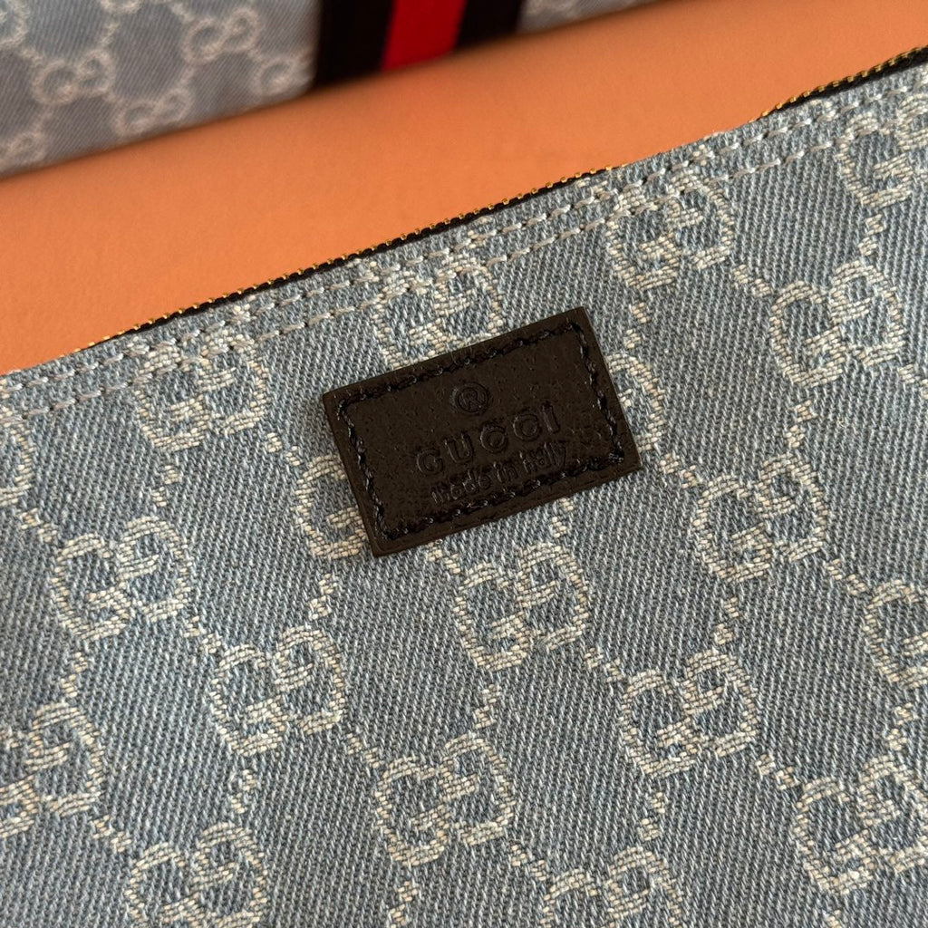 Gucci tote bag leather brand patch on blue monogram fabric