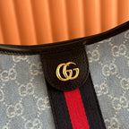 Gucci tote bag logo patch on blue monogram with black leather trim