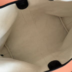 Gucci tote bag interior lining with stitched seams and fabric pocket tabs