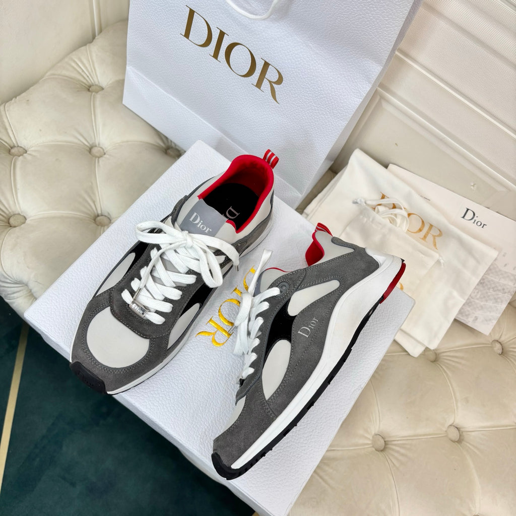 Unisex sneakers pair, gray and black with white panels, red accents, white laces