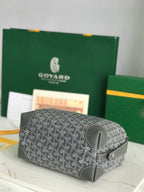 Goyard zip-around bag with dark gray monogram canvas and smooth dark leather trim