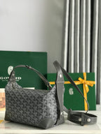 Goyard bag with dark gray monogram pattern, structured sides, and detachable crossbody strap