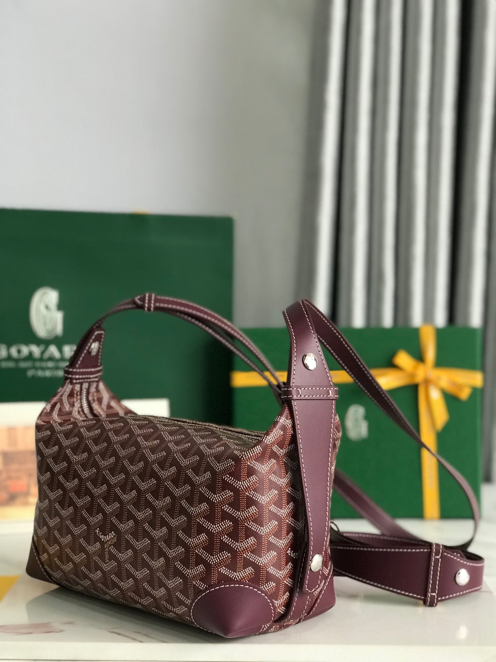 Patterned hobo bag with detachable shoulder strap and matching small crossbody pouch