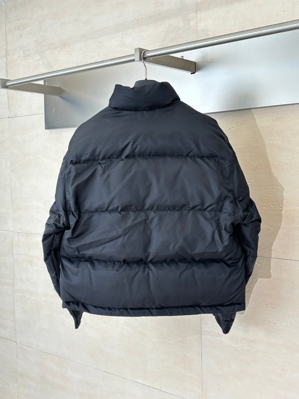 Balenciaga long puffer jacket, dark navy back view with quilted panels