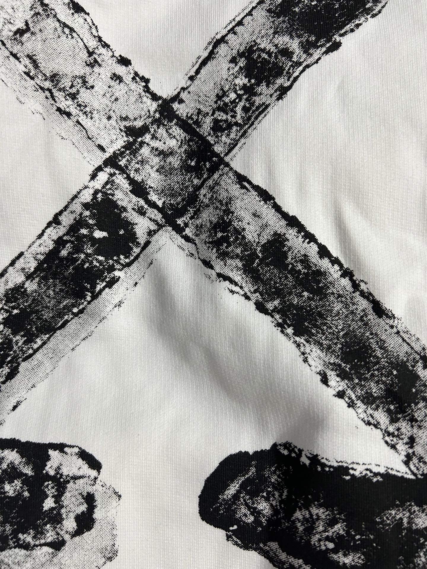 Off-white sweatshirt with bold black abstract print across the front