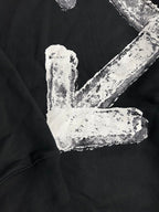 Black hoodie with distressed white arrow logo and block lettering