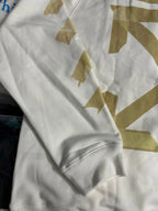 Off-White hooded sweatshirt sleeve and cuff with gold geometric print