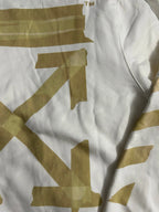 Off-White hooded sweatshirt fabric with gold graphic print across upper chest