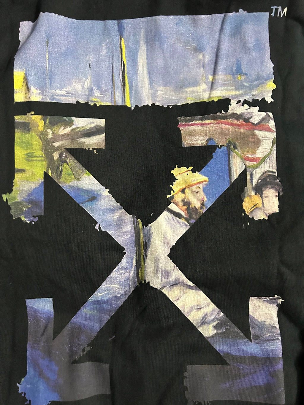 Off-White black hoodie back graphic with blue, yellow, and black collage