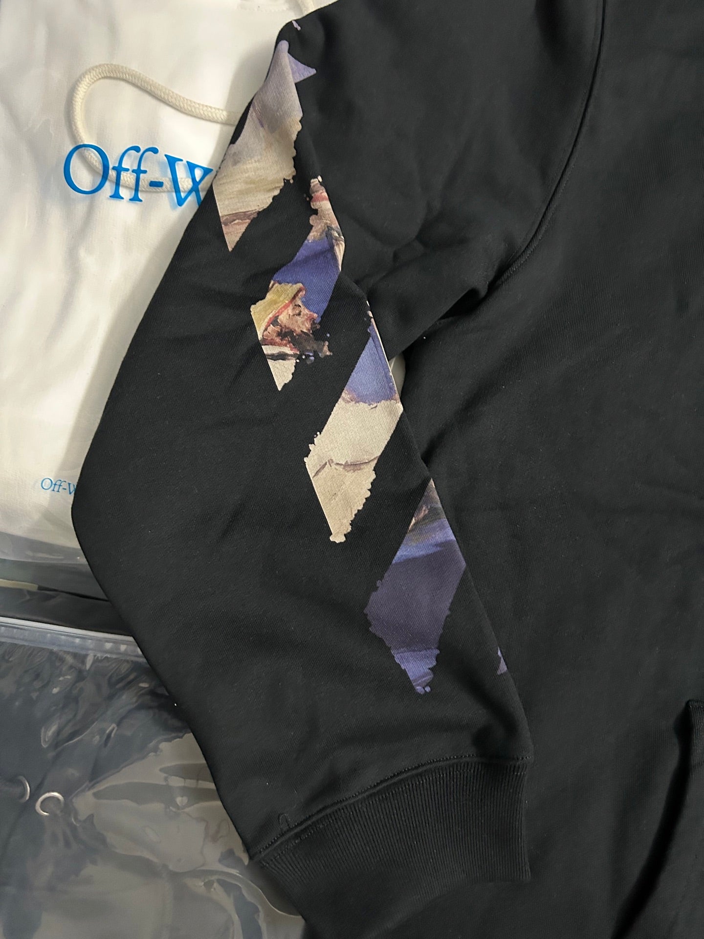 Off-White black hoodie sleeve with multicolor geometric graphic panel