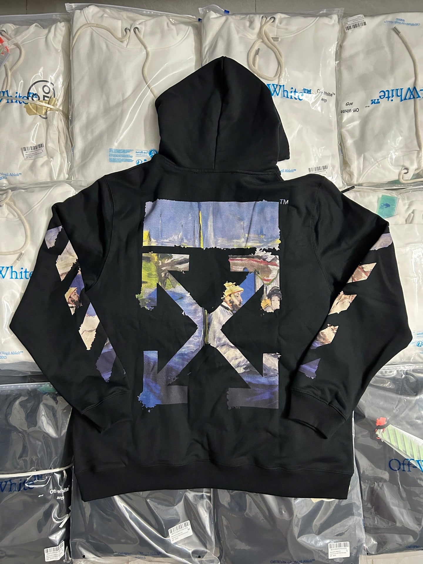 Black pullover hoodie with large back graphic and adjustable hood