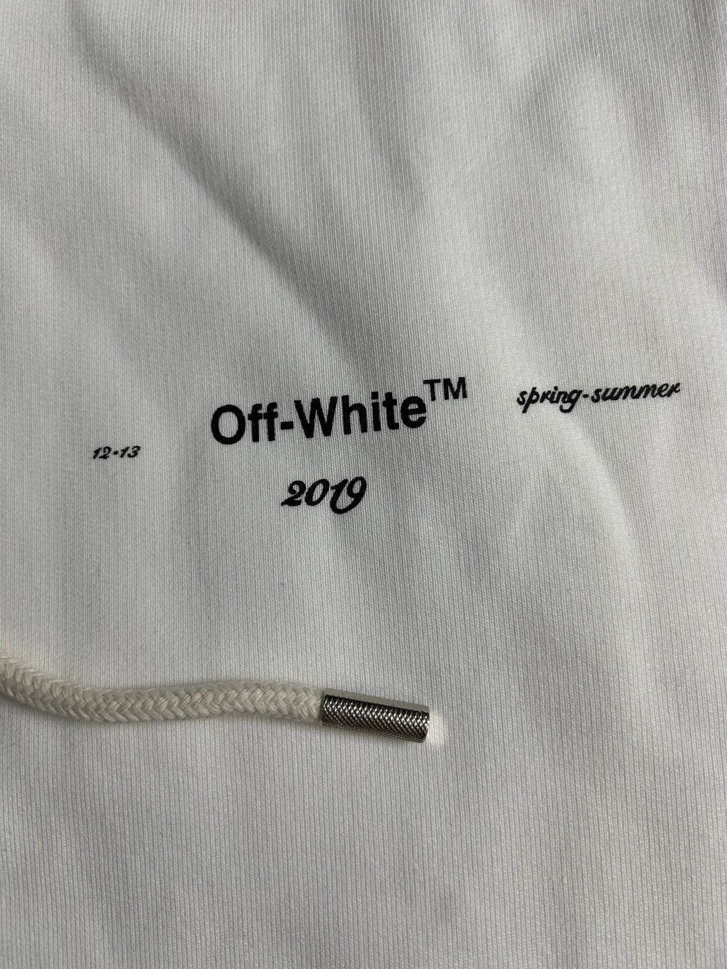 Off-White 2019 logo on white hoodie drawstring tip and knit fabric