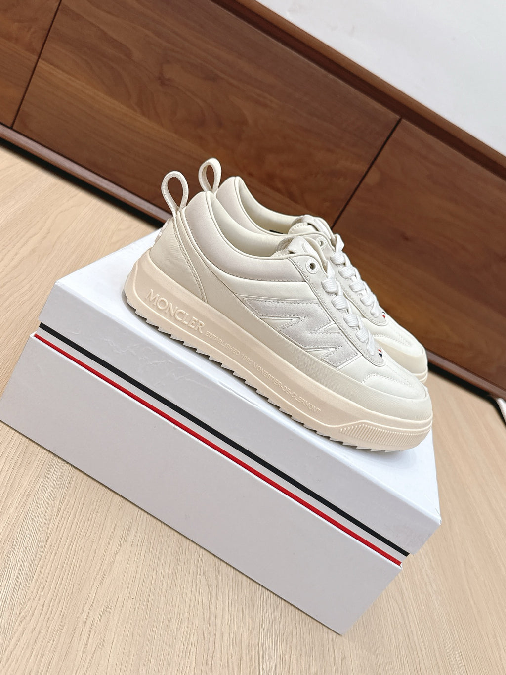 Moncler low-top sneakers, white lace-up with cushioned collar, chunky rubber sole