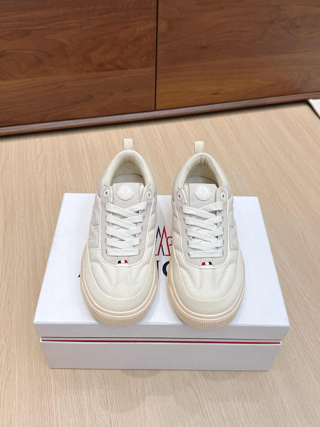 Moncler low-top sneakers, white leather lace-up, side logo patch, gum rubber sole