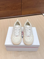 Moncler low-top sneakers, white leather lace-up, side logo patch, gum rubber sole