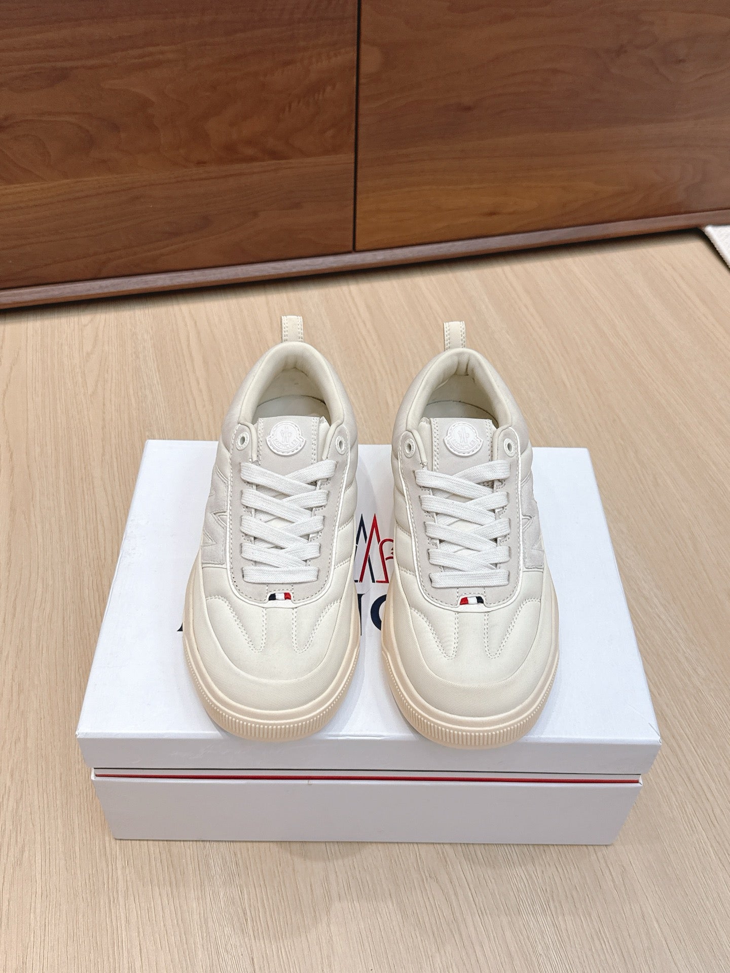 Moncler low-top sneakers, white leather lace-up, side logo patch, gum rubber sole