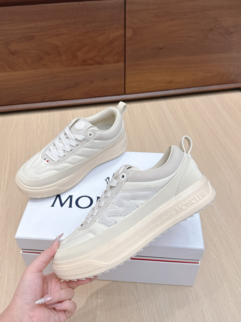 Moncler low-top sneakers, light white lace-up, stacked midsole, logo heel detail
