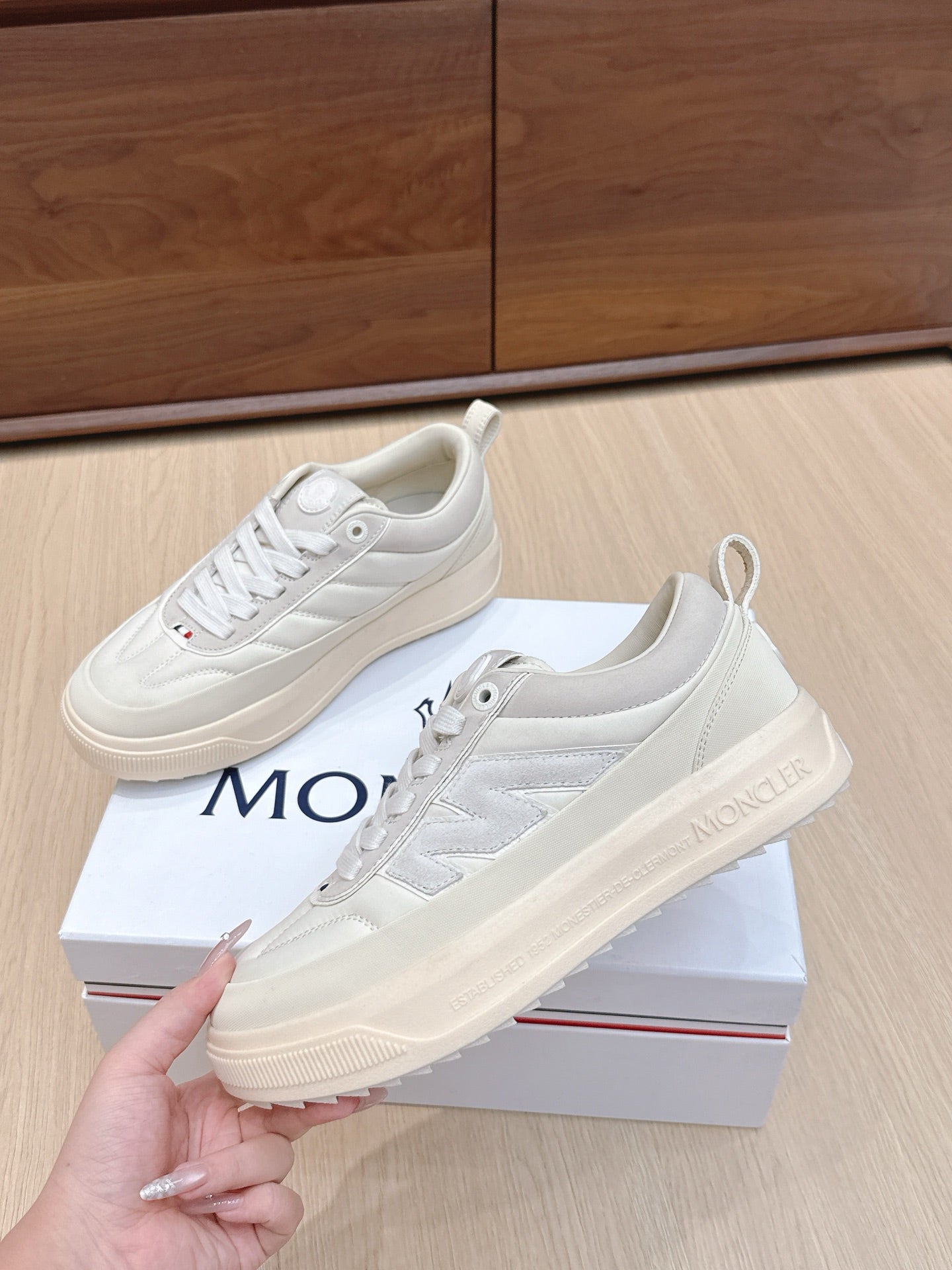 Moncler low-top sneakers, light white lace-up, stacked midsole, logo heel detail