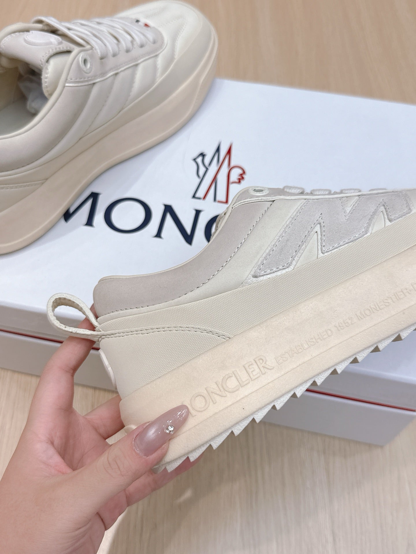 Moncler sneakers, white upper with stitched panels and branded rubber outsole