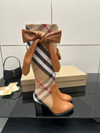 Burberry check ankle boots in tan leather with oversized bow at the shaft, block heel