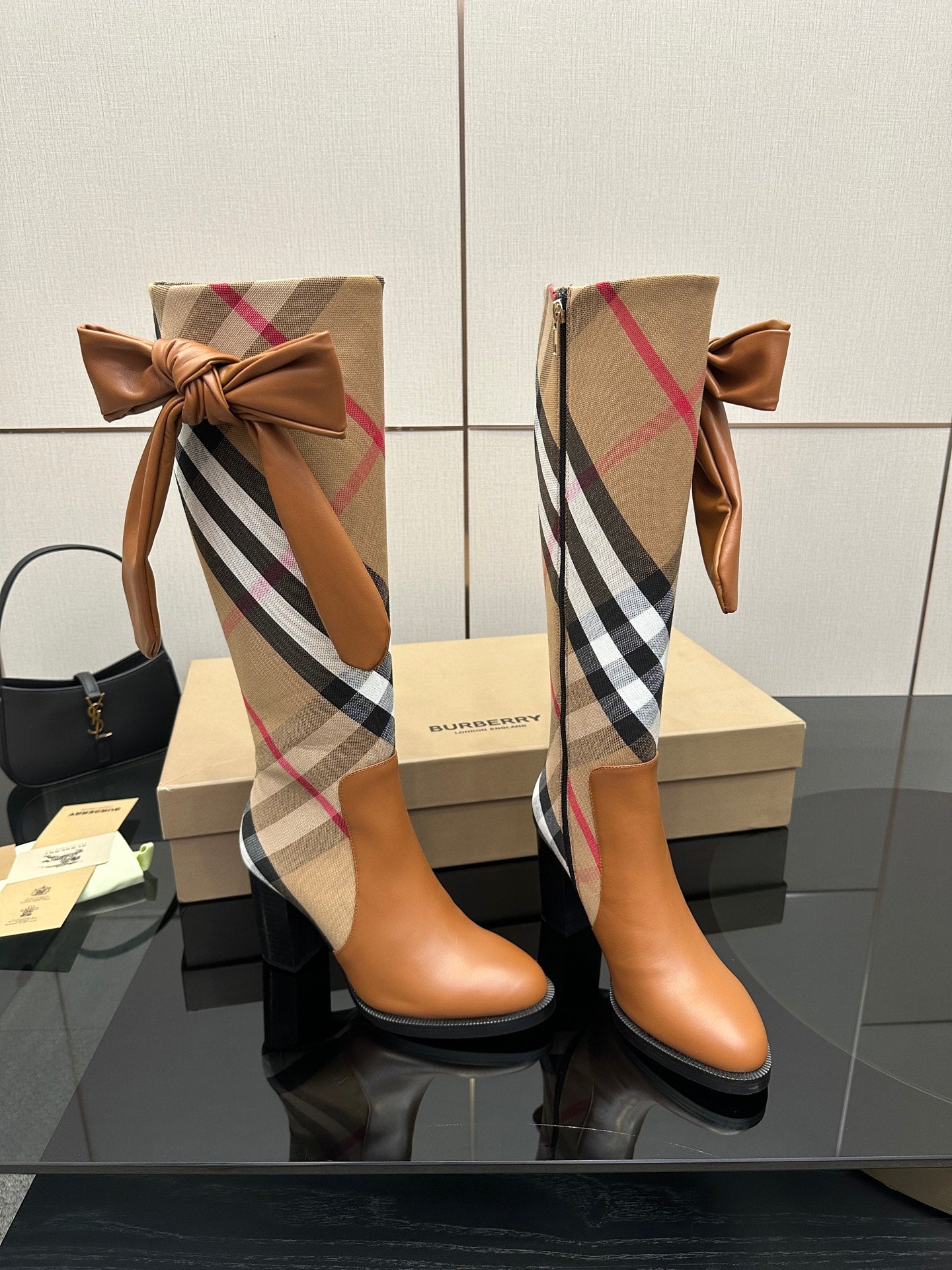 Pair of Burberry check ankle boots with tan leather bows at the shaft and block heels