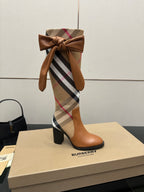 Burberry check ankle boots with tan leather, large bow at top, block heel view