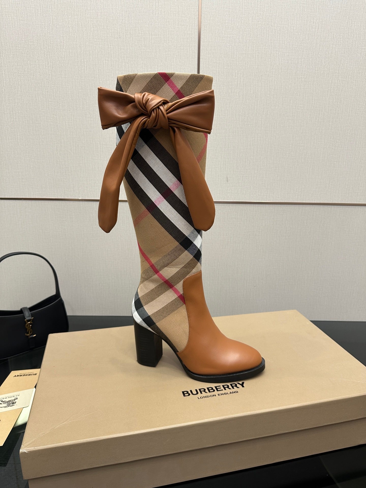 Burberry check ankle boots with tan leather, large bow at top, block heel view